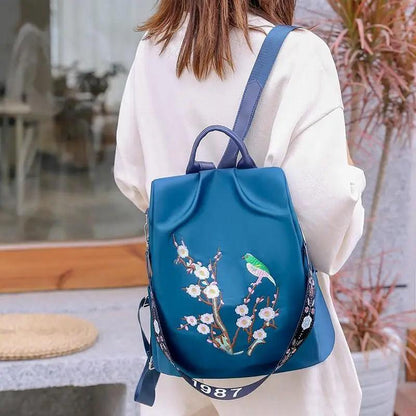 Modern Elegant Waterproof Women's Backpack by Stevvex in blue-teal with floral blossoms on Tampa Home & Garden Store