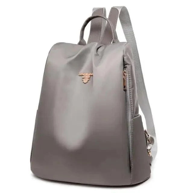 Stevvex waterproof gray school backpack ST27088EJO with front emblem and side zip pocket on Tampa Home & Garden Store