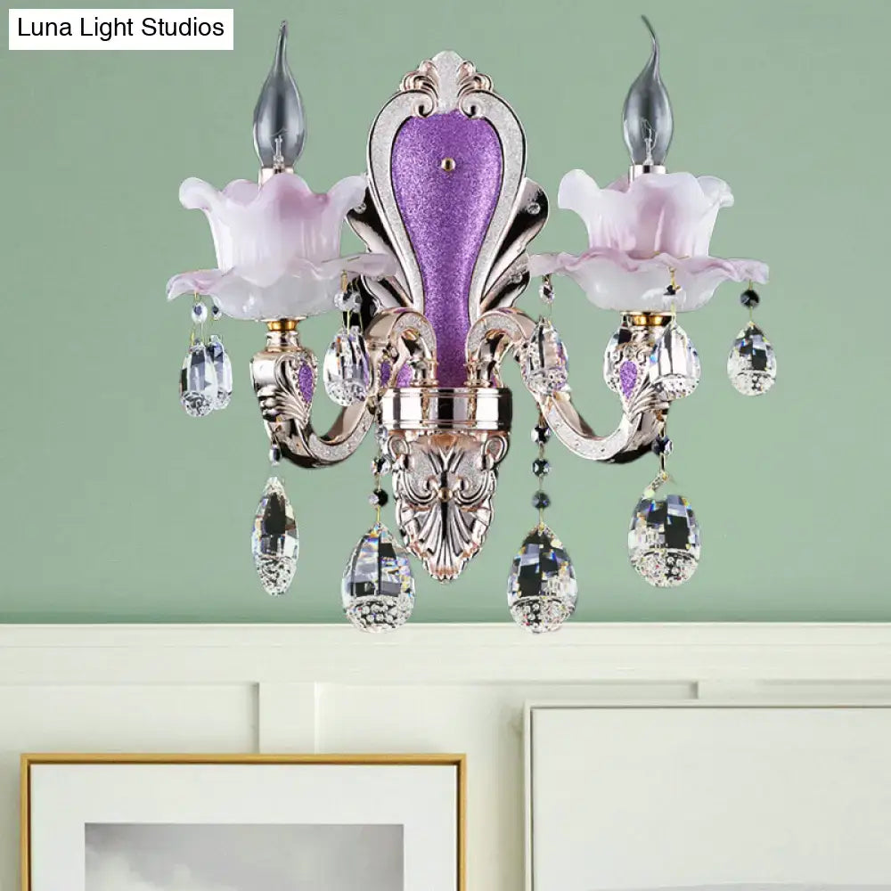 Purple glass crystal sconce by Decorbites with ornate silver frame and hanging crystal drops on Tampa Home & Garden Store