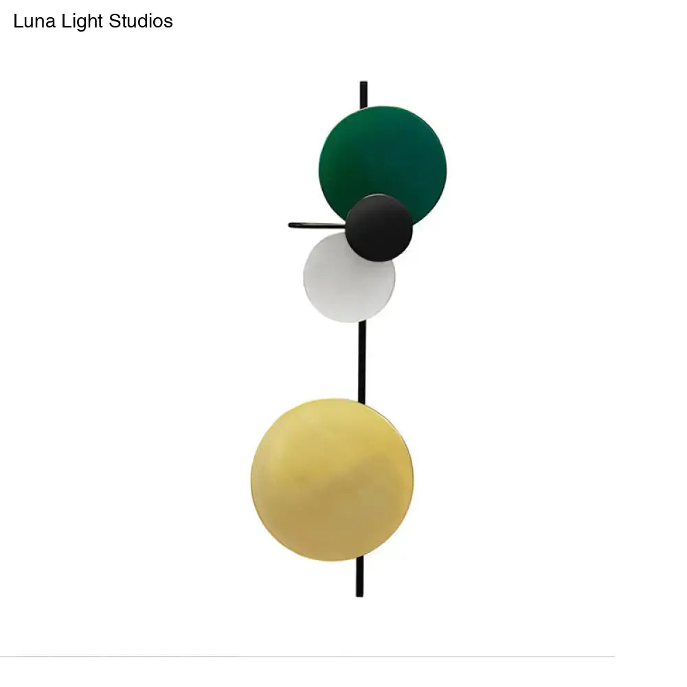 Wall sconce with stacked multicolor discs on a black vertical rod Decorbites on Tampa Home & Garden Store