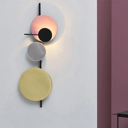 Decorbites red pink blue wall sconce with four adjustable circular discs on Tampa Home & Garden Store