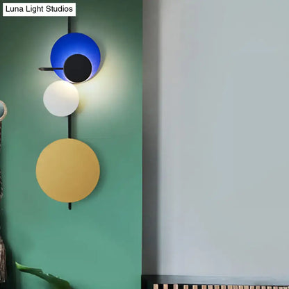 Wall sconce with blue white yellow circular discs, adjustable design by Decorbites on Tampa Home & Garden Store