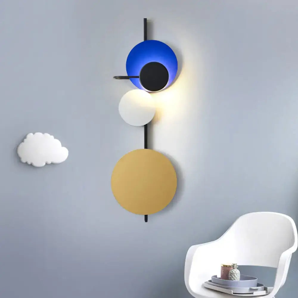 Decorbites wall sconce with adjustable circular discs in blue white and gold on Tampa Home & Garden Store