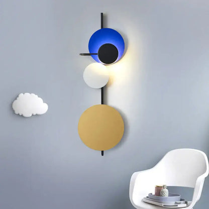 Decorbites wall sconce with adjustable circular discs in blue white and gold on Tampa Home & Garden Store