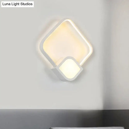 White acrylic square LED wall sconce by Decorbites with overlapping frame, warm light on Tampa Home & Garden Store