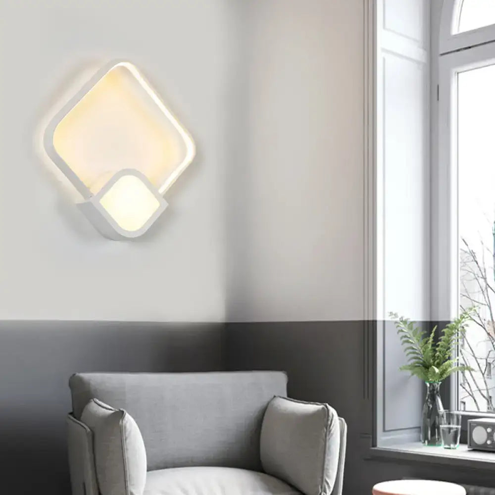 White acrylic square LED wall sconce with overlapping frames, warm glow Decorbites on Tampa Home & Garden Store
