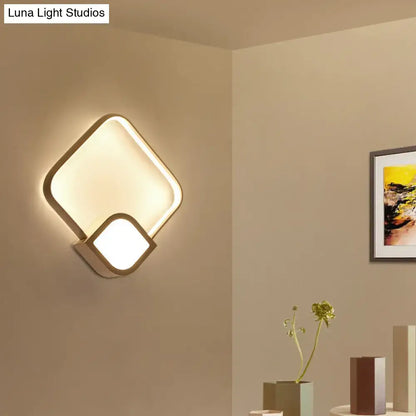 White acrylic square LED wall sconce by Decorbites with overlapping rounded-square frames on Tampa Home & Garden Store