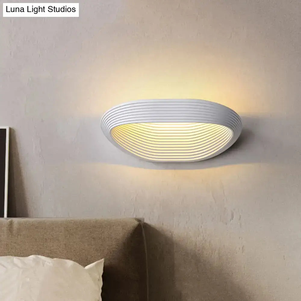 White ribbed circular LED wall light with warm glow on Tampa Home & Garden Store