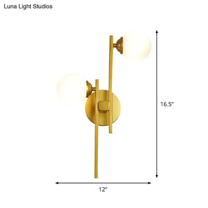 Decorbites gold glass dual-light wall sconce with frosted glass globes on Tampa Home & Garden Store