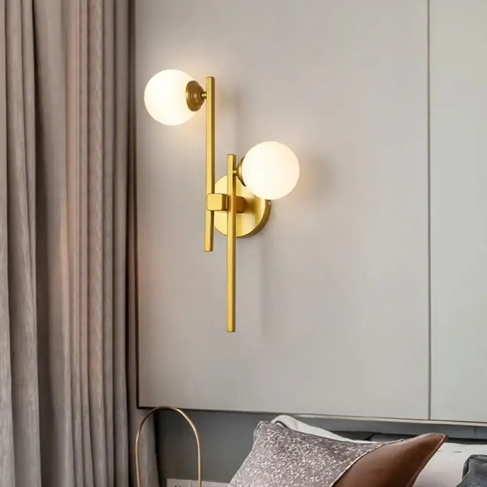 Gold glass dual-light wall sconce with frosted globes in gold finish by Decorbites on Tampa Home & Garden Store