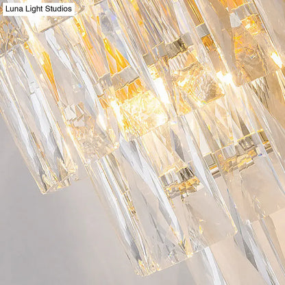 Gold crystal rectangle-cut three-light sconce with hanging prisms on Tampa Home & Garden Store