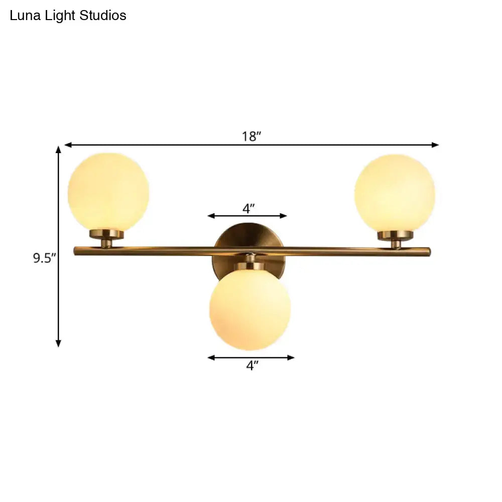 Gold Modern Wall Sconce with brass bar and three frosted glass globes (ends+bottom) Decorbites on Tampa Home & Garden Store