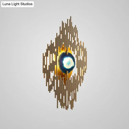Modern gold agate deco wall sconce with brass spokes around blue agate centerpiece on Tampa Home & Garden Store