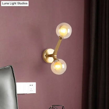 Gold amber glass wall sconce with dual globe bulbs in brass finish Decorbites on Tampa Home & Garden Store