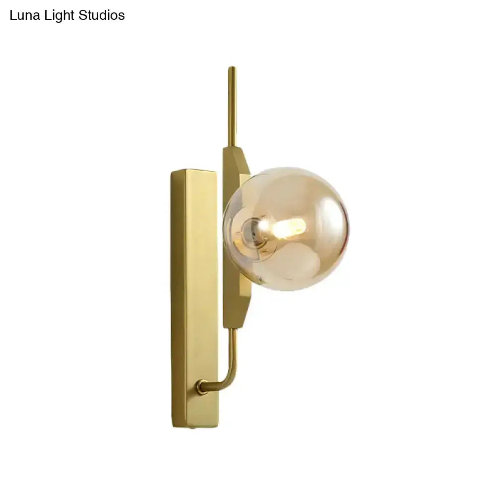 Decorbites gold brass orb wall sconce with amber glass globe 110–120V on Tampa Home & Garden Store