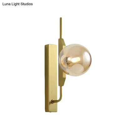 Decorbites gold brass orb wall sconce with amber glass globe 110–120V on Tampa Home & Garden Store