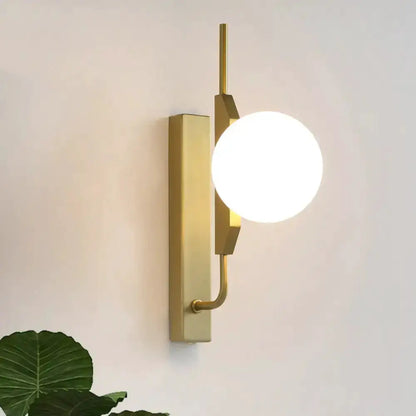 Modern gold wall sconce with amber glass orb and white globe by Decorbites 110-120V on Tampa Home & Garden Store