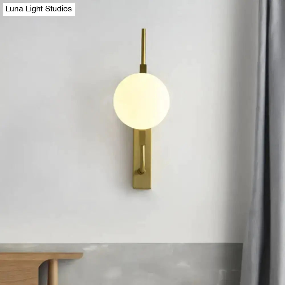 Modern gold glass orb wall sconce with frosted amber globe, 110–120V by Decorbites on Tampa Home & Garden Store