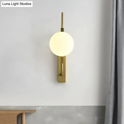 Modern gold glass orb wall sconce with frosted amber globe, 110–120V by Decorbites on Tampa Home & Garden Store
