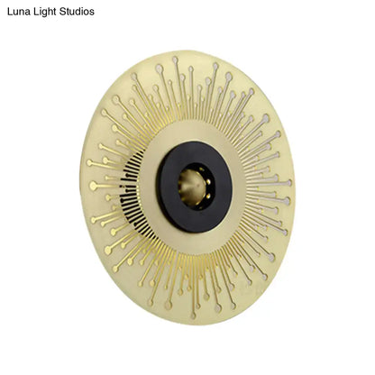 Gold and black disk laser-cut sconce by Decorbites with sunburst rays and black center ring on Tampa Home & Garden Store