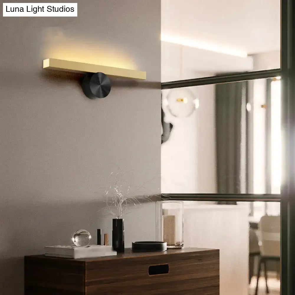 Gold Black Linear Wall Light by Decorbites mounted on gray wall with warm glow on Tampa Home & Garden Store