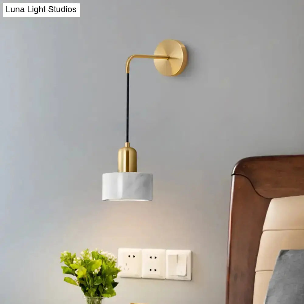 Modern gold and black marble pendant light fixture mounted on wall with marble shade on Tampa Home & Garden Store