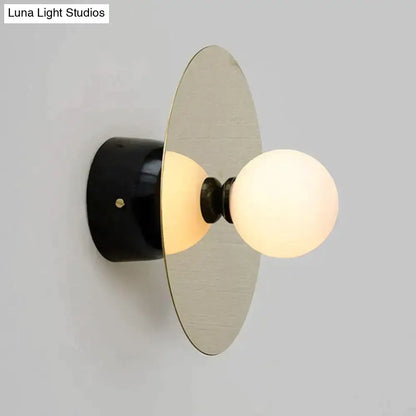 Gold Black Riya Wall Light wall sconce with frosted glass globe and gold disc Decorbites on Tampa Home & Garden Store