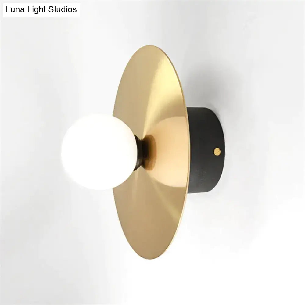 Gold Black Riya Wall Light wall sconce with brass gold disc and white globe bulb Decorbites on Tampa Home & Garden Store