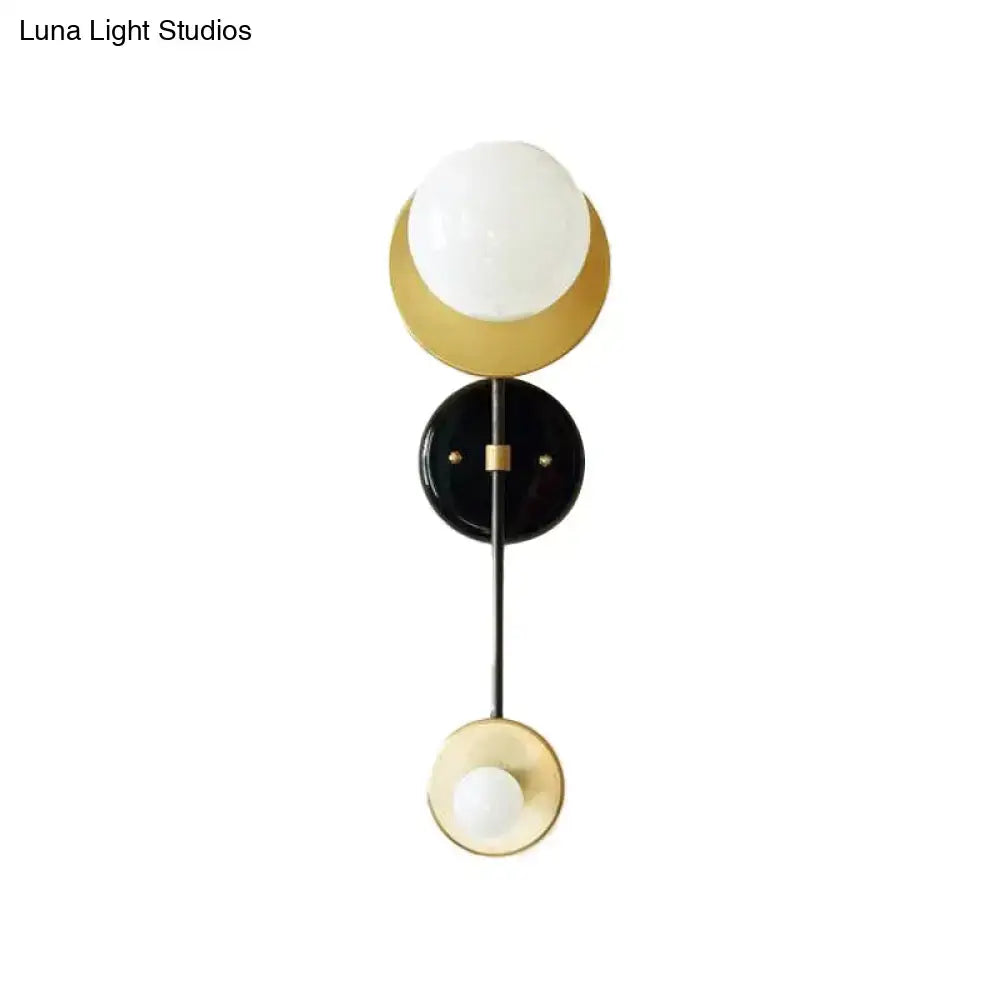 Gold Black Opal Wall Sconce by Decorbites with white glass globe and gold metal accents on Tampa Home & Garden Store