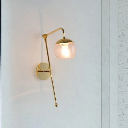 Gold brass G4 sconce with pink glass shade on curved arm, wall-mounted single-light on Tampa Home & Garden Store