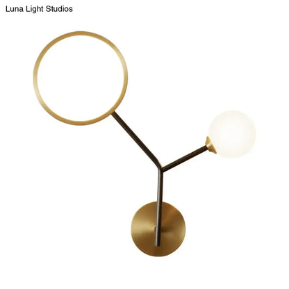 Gold Cream Glass Compact Wall Sconce with halo and frosted globe on black metal stem on Tampa Home & Garden Store