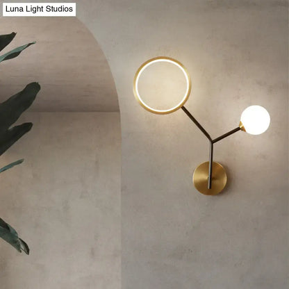 Gold cream glass compact wall sconce with circular ring light and globe bulb, brass finish on Tampa Home & Garden Store