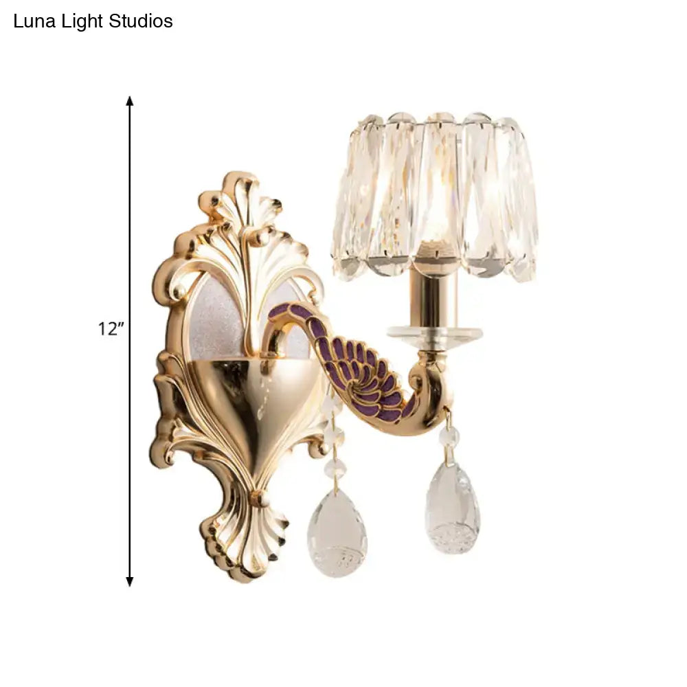 Gold Peacock Wall Sconce by Decorbites; brass backplate, crystal shade, hanging prisms on Tampa Home & Garden Store