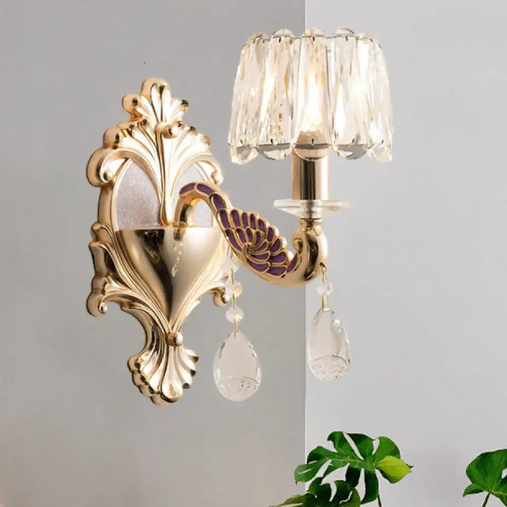 Gold peacock wall sconce by Decorbites, ornate backplate, purple accents, crystal pendants on Tampa Home & Garden Store