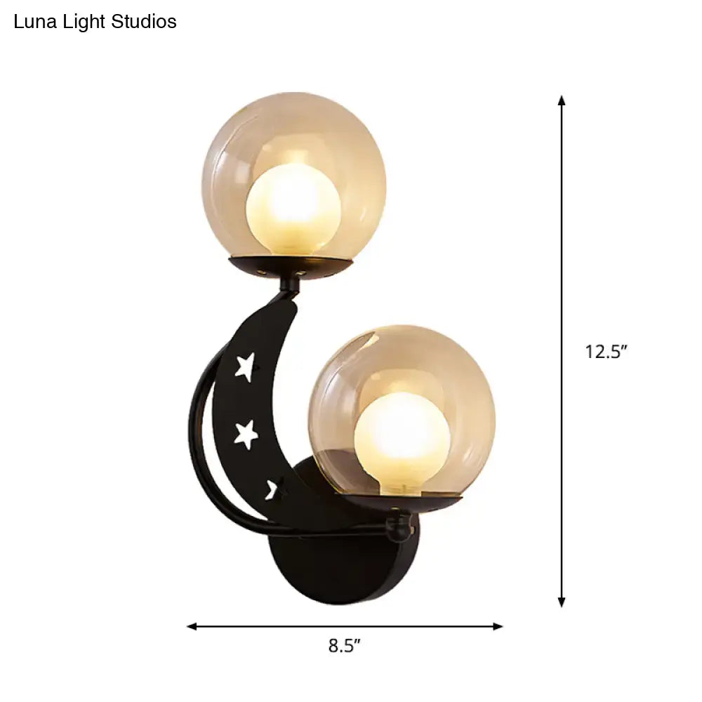 Gold Ball Wall Sconce by Decorbites with dual glass globes on a black curved metal frame on Tampa Home & Garden Store