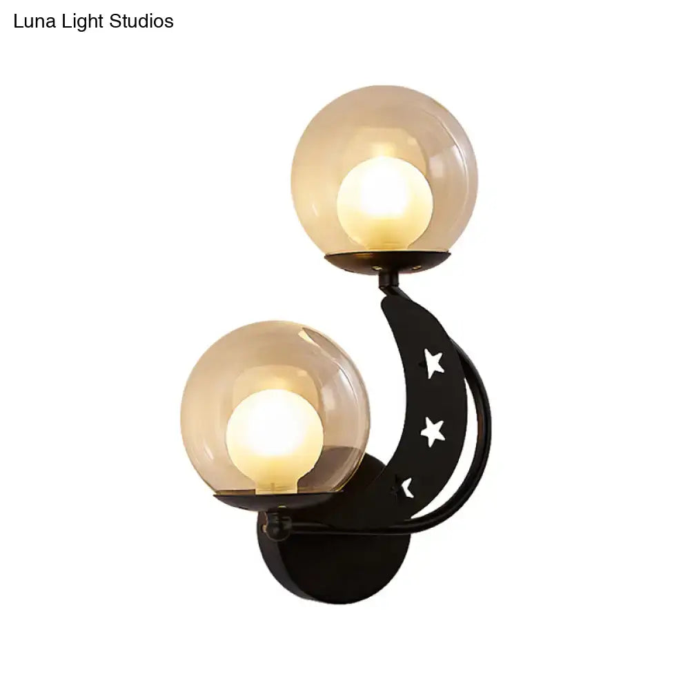 Gold Ball Wall Sconce by Decorbites featuring twin amber glass globes on a black curved arm on Tampa Home & Garden Store