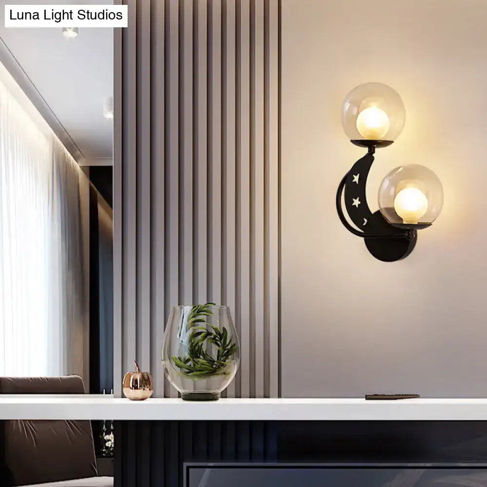 Gold Ball Wall Sconce with dual clear glass globes on a black crescent moon mount Decorbites on Tampa Home & Garden Store