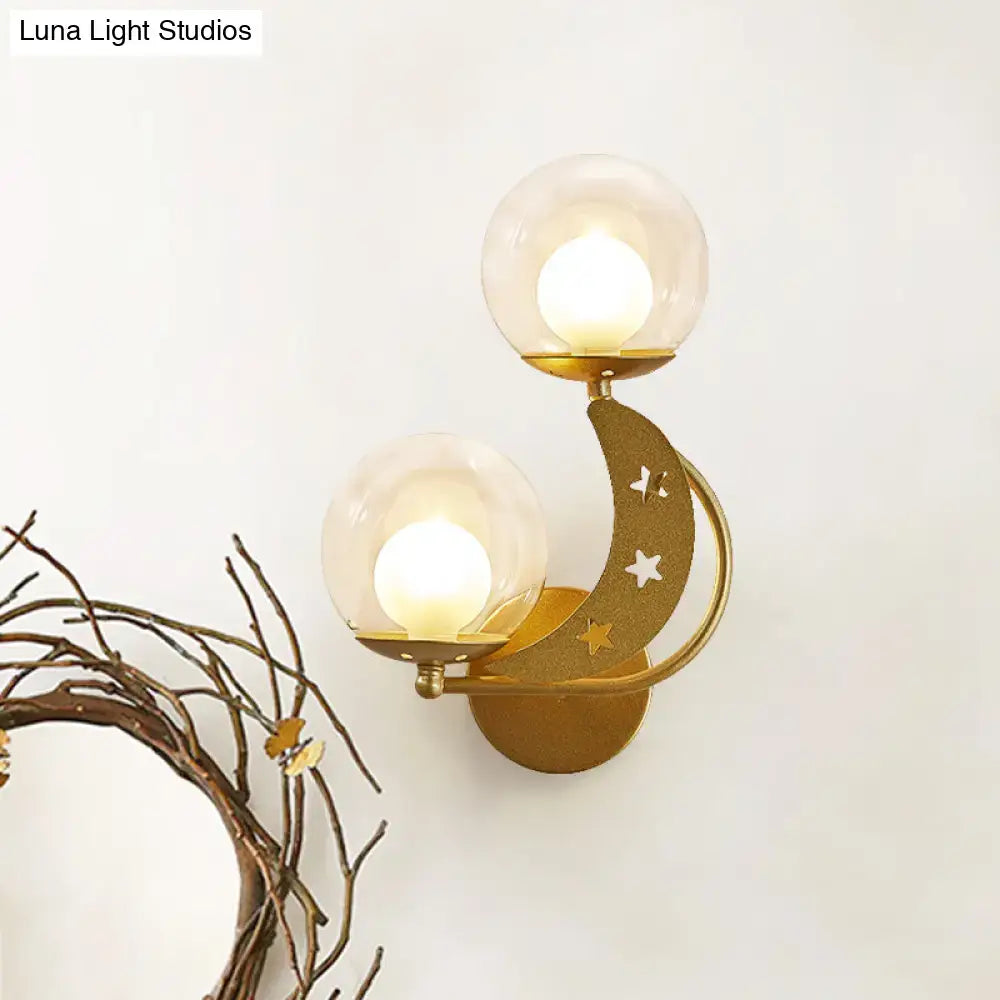 Gold ball wall sconce with dual glass globes and crescent moon star accent by Decorbites on Tampa Home & Garden Store