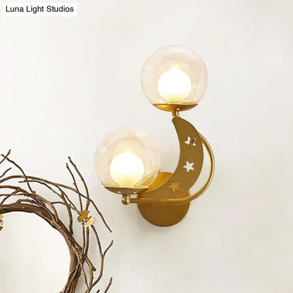 Gold ball wall sconce with dual glass globes and crescent moon star accent by Decorbites on Tampa Home & Garden Store