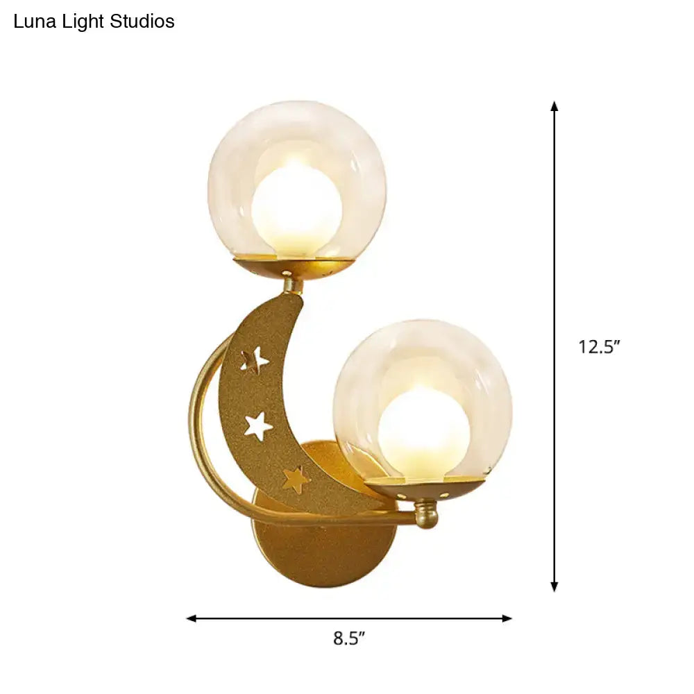 Gold Ball Wall Sconce by Decorbites, gold crescent arm with star cutouts and dual glass globes on Tampa Home & Garden Store