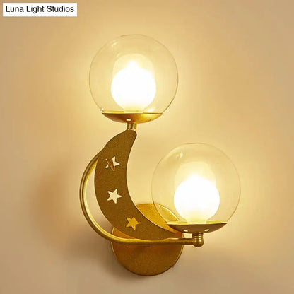 Decorbites gold ball wall sconce crescent moon cutouts and dual glass globes on gold mount on Tampa Home & Garden Store
