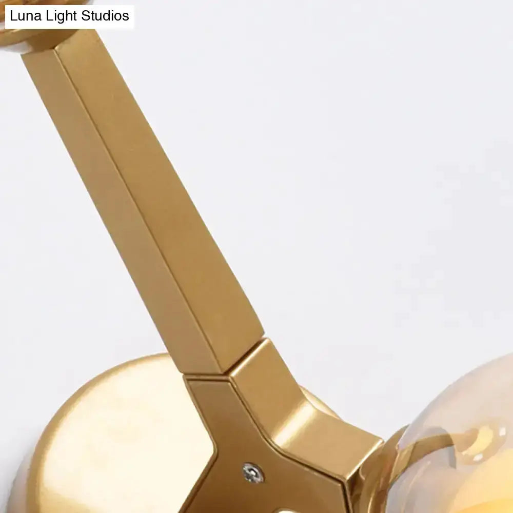 Modern gold & black double globe corridor wall lamp with gold metal arm and clear glass globes on Tampa Home & Garden Store