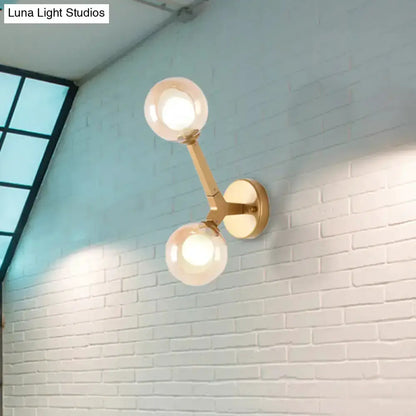 Modern gold double-globe wall lamp with two glass globes, Decorbites sconce on Tampa Home & Garden Store