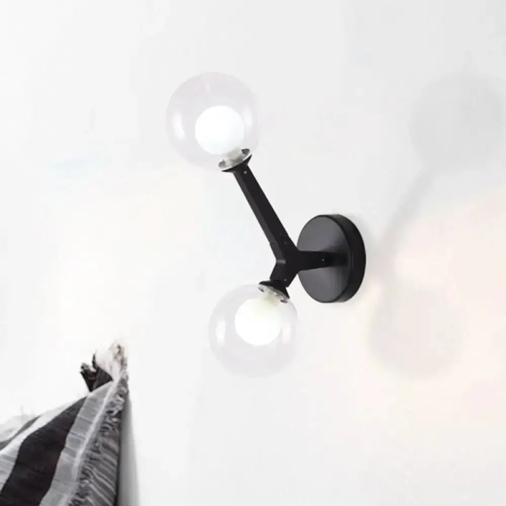 Decorbites black dual-globe wall sconce with glass globes for corridor lighting on Tampa Home & Garden Store
