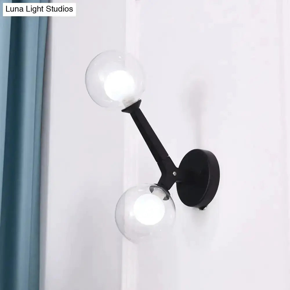 Decorbites modern black double-globe wall lamp with two clear glass globes on Tampa Home & Garden Store