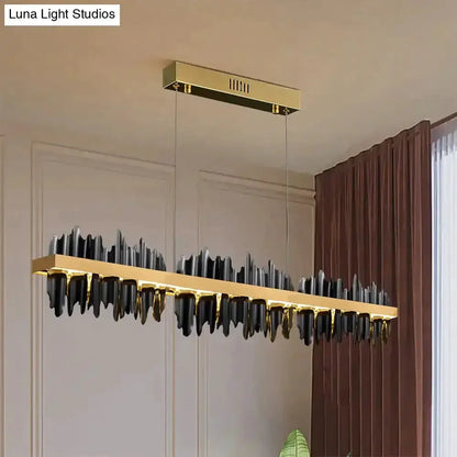 Modern gold and black iceberg LED pendant chandelier with a gold bar and black glass icicles on Tampa Home & Garden Store