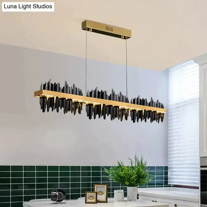 Modern gold and black iceberg LED chandelier pendant with gold bar and black glass accents on Tampa Home & Garden Store