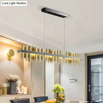 Modern gold and black iceberg LED chandelier by Decorbites hanging above dining table on Tampa Home & Garden Store