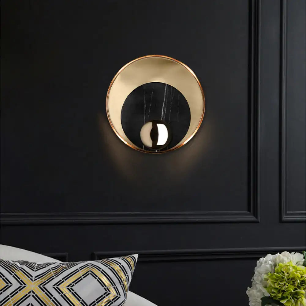 Marble Peacock Wall Sconce by Decorbites; gold-rimmed round face with black marble center on Tampa Home & Garden Store