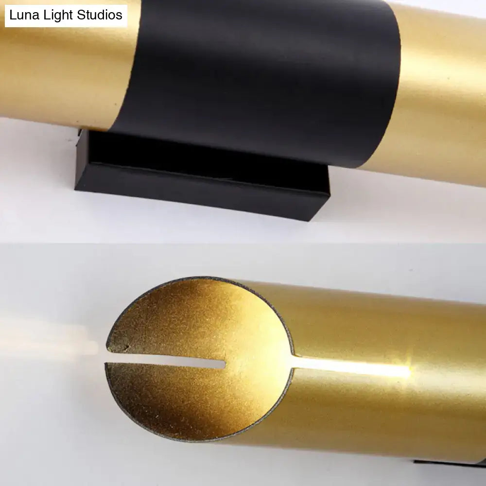 Gold black cylinder wall sconce by Decorbites with a black mounting base on Tampa Home & Garden Store